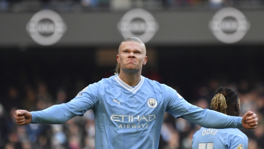 Manchester City's Erling Haaland celebrates after scoring his side's opening goal during the English Premier League soccer match between Manchester City and Liverpool at Etihad stadium in Manchester, England, Saturday, Nov. 25, 2023. (AP Photo/Rui Vieira)