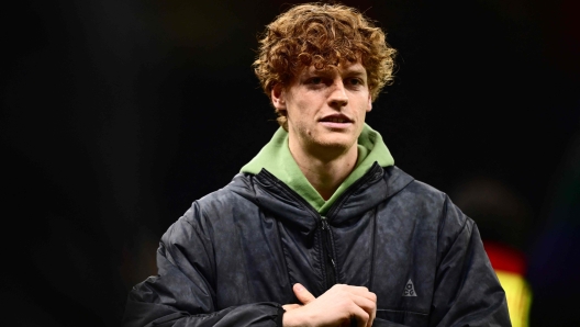 Italy's tennis player Jannik Sinner arrives to watch the UEFA Champions League Group F football match between AC Milan and Borussia Dortmund at the San Siro stadium in Milan on November 28, 2023. (Photo by Marco BERTORELLO / AFP)