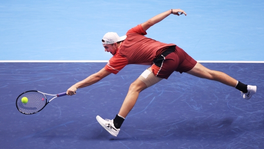 JEDDAH, SAUDI ARABIA - NOVEMBER 29: Dominic Stricker of Switzerland lunges for a backhand during his second round robin match against Luca Nardi of Italy during day two of the Next Gen ATP Finals at King Abdullah Sports City on November 29, 2023 in Jeddah, Saudi Arabia. (Photo by Adam Pretty/Getty Images)