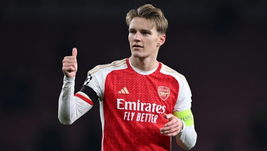 LONDON, ENGLAND - NOVEMBER 29: Martin Odegaard of Arsenal reacts  after the team's victory in the UEFA Champions League match between Arsenal FC and RC Lens at Emirates Stadium on November 29, 2023 in London, England. (Photo by Mike Hewitt/Getty Images)