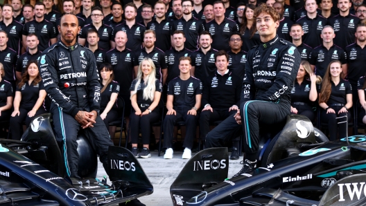 ABU DHABI, UNITED ARAB EMIRATES - NOVEMBER 23: Lewis Hamilton of Great Britain and Mercedes and George Russell of Great Britain and Mercedes look on at the Mercedes GP Team Photo during previews ahead of the F1 Grand Prix of Abu Dhabi at Yas Marina Circuit on November 23, 2023 in Abu Dhabi, United Arab Emirates. (Photo by Clive Rose/Getty Images)