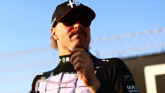 ABU DHABI, UNITED ARAB EMIRATES - NOVEMBER 26: Valtteri Bottas of Finland and Alfa Romeo F1 prepares to drive on the grid prior to the F1 Grand Prix of Abu Dhabi at Yas Marina Circuit on November 26, 2023 in Abu Dhabi, United Arab Emirates. (Photo by Clive Rose/Getty Images)