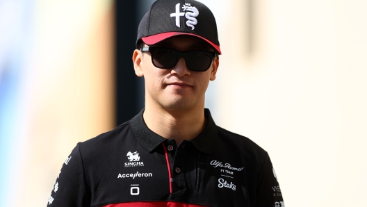 ABU DHABI, UNITED ARAB EMIRATES - NOVEMBER 24: Zhou Guanyu of China and Alfa Romeo F1 walks in the Paddock prior to practice ahead of the F1 Grand Prix of Abu Dhabi at Yas Marina Circuit on November 24, 2023 in Abu Dhabi, United Arab Emirates. (Photo by Clive Rose/Getty Images)