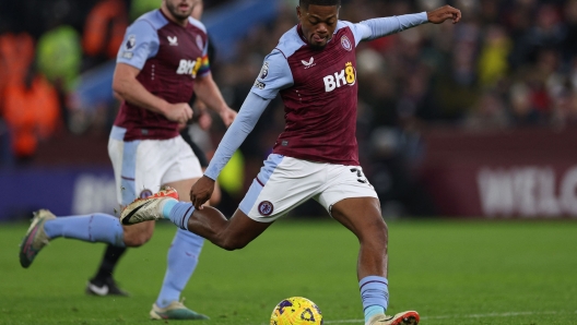 Aston Villa's Jamaican striker #31 Leon Bailey shoots to score the opening goal during the English Premier League football match between Aston Villa and Manchester City at Villa Park in Birmingham, central England on December 6, 2023. (Photo by Adrian DENNIS / AFP) / RESTRICTED TO EDITORIAL USE. No use with unauthorized audio, video, data, fixture lists, club/league logos or 'live' services. Online in-match use limited to 120 images. An additional 40 images may be used in extra time. No video emulation. Social media in-match use limited to 120 images. An additional 40 images may be used in extra time. No use in betting publications, games or single club/league/player publications. /