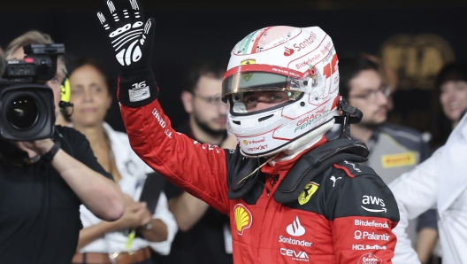 Ferrari driver Charles Leclerc of Monaco waves after qualifying session ahead of the Abu Dhabi Formula One Grand Prix at the Yas Marina Circuit, Abu Dhabi, UAE, Saturday, Nov. 25, 2023. (Ali Haider/Pool via AP)