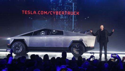 File - Tesla CEO Elon Musk introduces the Cybertruck at Tesla's design studio on Nov. 21, 2019, in Hawthorne, Calif. The windows were broken during a demonstration intended to show the strength of the glass. Musk is expected to give an update on manufacturing problems with the long-awaited Cybertruck at an event Thursday marking the first deliveries of the futuristic, angular pickup truck. (AP Photo/Ringo H.W. Chiu)