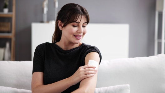 Woman With Contraception Patch Treatment On Arm