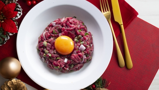 Christmas food served on a table decorated with Christmas motifs.