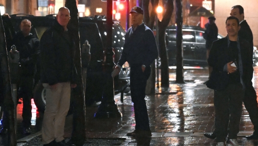 US President Joe Biden (C) looks on after a car hit an SUV in the motorcade as he left his campaign headquarters in Wilmington, Delaware on December 17, 2023. (Photo by ANDREW CABALLERO-REYNOLDS / AFP)