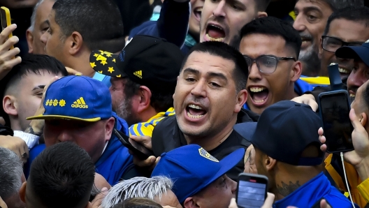 BUENOS AIRES, ARGENTINA - DECEMBER 17: Former player and candidate for President of Boca Juniors Juan Roman Riquelme greets the fans after voting during the presidential elections in Boca Juniors, after a court suspension due to suspicions of irregularities in the membership roster on December 17, 2023 in Buenos Aires, Argentina. The election pits Legendary playmaker Juan Roman Riquelme and the former president of the club and Argentina Mauricio Macri, who runs as vice president of Andres Ibarra. (Photo by Marcelo Endelli/Getty Images)