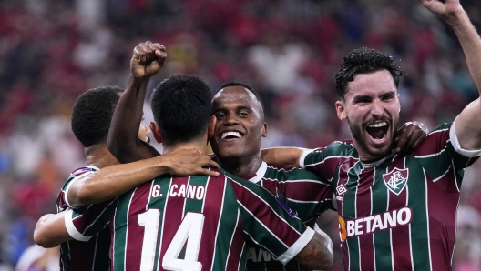 Fluminense's Jhon Arias, center, celebrates after scoring the opening goal during the Soccer Club World Cup semifinal soccer match between Fluminense FC and Al Ahly FC at King Abdullah Sports City Stadium in Jeddah, Saudi Arabia, Monday, Dec. 18, 2023. (AP Photo/Manu Fernandez)