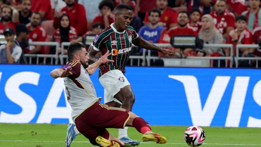 Fluminense's Colombian midfielder #21 Jhon Arias fights for the ball with Ahly's Egyptian defender #06 Yasser Ibrahim during the FIFA Club World Cup football semi-final football match between Brazil's Fluminense and Egypt's Al-Ahly at King Abdullah Sport City in Jeddah on December 18, 2023. (Photo by Giuseppe CACACE / AFP)