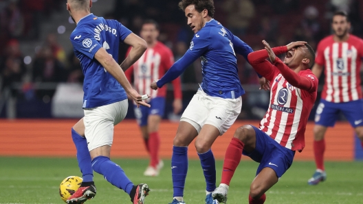 Atletico Madrid's Brazilian forward #12 Samuel Lino (R) reacts during the Spanish league football match between Club Atletico de Madrid and Getafe CF at the Metropolitano stadium in Madrid on December 19, 2023. (Photo by Thomas COEX / AFP)