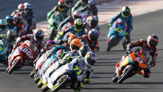 Japan's rider Ayumu Sasaki of the Liqui Moly Husqvarna Intact GP leads the pack at the start of the Moto 3 race of the Valencia Motorcycle Grand Prix, the last race of the season, at the Ricardo Tormo circuit in Cheste near Valencia, Spain, Sunday, Nov. 26, 2023. (AP Photo/Alberto Saiz)