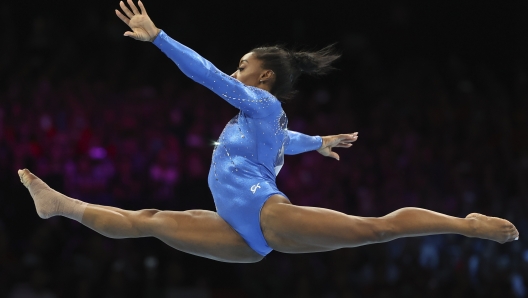 United States' Simone Biles, who won the gold medal, competes on the floor during the women's all-round final at the Artistic Gymnastics World Championships in Antwerp, Belgium, Friday, Oct. 6, 2023. (AP Photo/Geert vanden Wijngaert)