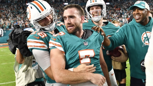 Miami Dolphins place kicker Jason Sanders, right, walks off the field with punter Jake Bailey (16) after an NFL football game against the Dallas Cowboys, Sunday, Dec. 24, 2023, in Miami Gardens, Fla. (AP Photo/Michael Laughlin)