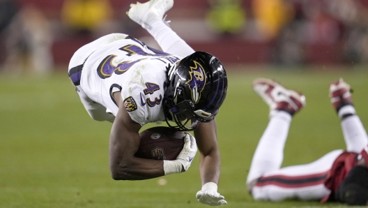 Baltimore Ravens running back Justice Hill (43) falls forward after being tackled against the San Francisco 49ers during the second half of an NFL football game in Santa Clara, Calif., Monday, Dec. 25, 2023. (AP Photo/Godofredo A. Vásquez)