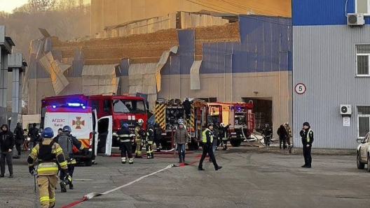 In this photo provided by the Ukrainian Emergency Service, firefighters work on a site of a building damaged after a Russian attack in Kyiv, Ukraine, Friday, Dec. 29, 2023. (Ukrainian Emergency Service via AP)