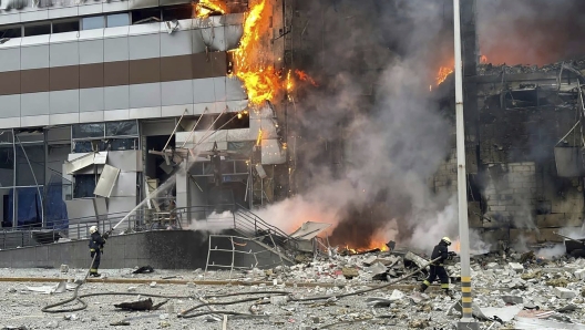 In this photo provided by the Ukrainian Emergency Service, firefighters work on a site of a building damaged after a Russian attack in Kyiv, Ukraine, Friday, Dec. 29, 2023. (Ukrainian Emergency Service via AP)