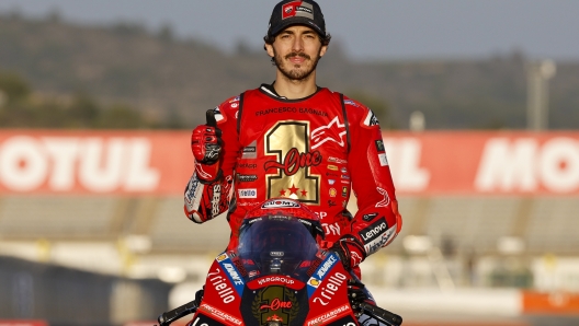 Moto GP World Champion Italian rider Francesco Bagnaia of the Ducati Lenovo Team poses after the last race of the season, at the Ricardo Tormo circuit in Cheste near Valencia, Spain, Sunday, Nov. 26, 2023. (AP Photo/Alberto Saiz)