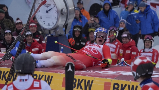 Switzerland's Marco Odermatt celebrates winning an alpine ski, men's World Cup giant slalom race, in Adelboden, Switzerland, Saturday, Jan. 6, 2024. (AP Photo/Giovanni Auletta)