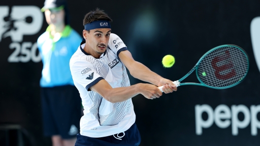 ADELAIDE, AUSTRALIA - JANUARY 09: Lorenzo Sonego of Italy plays a backhand during their match against Yannick Hanfmann of Germany  in the 2024 Adelaide International at Memorial Drive on January 09, 2024 in Adelaide, Australia. (Photo by Sarah Reed/Getty Images)