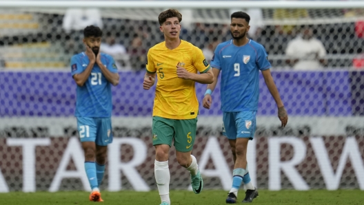 Australia's Jordan Bos runs after scoring his side's second goal during the Asian Cup Group B soccer match between Australia and India at Ahmad Bin Ali Stadium in Doha, Qatar, Saturday, Jan. 13, 2024. (AP Photo/Aijaz Rahi)