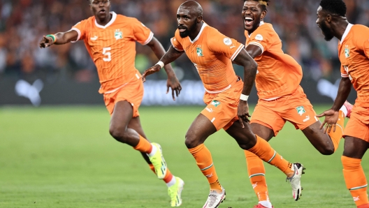 Ivory Coast's midfielder #6 Seko Fofana (C) celebrates scoring his team's first goal during the Africa Cup of Nations (CAN) 2024 group A football match between Ivory Coast and Guinea-Bissau at the Alassane Ouattara Olympic Stadium in Ebimpe, Abidjan, on January 13, 2024. (Photo by FRANCK FIFE / AFP)