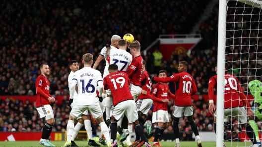 MANCHESTER, ENGLAND - JANUARY 14: Richarlison of Tottenham Hotspur scores their team's first goal during the Premier League match between Manchester United and Tottenham Hotspur at Old Trafford on January 14, 2024 in Manchester, England. (Photo by Naomi Baker/Getty Images)