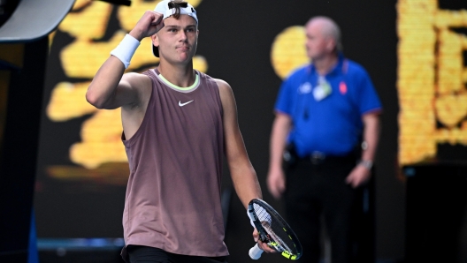 epa11081713 Holger Rune of Denmark celebrates match point during his round 1 match win over Yoshihito Nishioka of Japan on Day 3 of the 2024 Australian Open at Melbourne Park in Melbourne, Australia 16 January 2024.  EPA/JOEL CARRETT AUSTRALIA AND NEW ZEALAND OUT