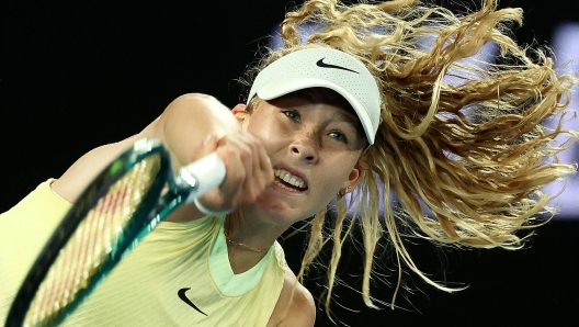 TOPSHOT - Russia's Mirra Andreeva serves against Tunisia's Ons Jabeur during their women's singles match on day four of the Australian Open tennis tournament in Melbourne on January 17, 2024. (Photo by David GRAY / AFP) / -- IMAGE RESTRICTED TO EDITORIAL USE - STRICTLY NO COMMERCIAL USE --