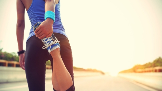 young woman runner warm up outdoor