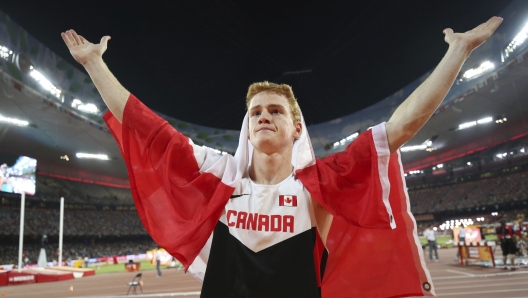 FILE - Canada's Shawn Barber celebrates after winning the gold medal in the men's pole vault final at the World Athletics Championships at the Bird's Nest stadium in Beijing, Monday, Aug. 24, 2015. Barber has died from medical complications. He was 29. Barber died Wednesday, Jan. 17, 2024, at home in Kingwood, Texas, his agent, Paul Doyle, confirmed to The Associated Press.(Christian Charisius/dpa via AP, File)