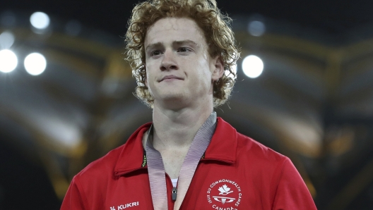 FILE - Men's pole vault silver medalist Canada's Shawnacy Barber is shown on the podium at Carrara Stadium during the 2018 Commonwealth Games on the Gold Coast, Australia, Thursday, April 12, 2018. Barber has died from medical complications. He was 29. Barber died Wednesday, Jan. 17, 2024, at home in Kingwood, Texas, his agent, Paul Doyle, confirmed to The Associated Press. (AP Photo/Mark Schiefelbein, File)