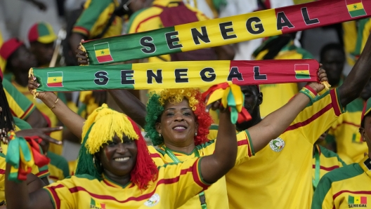 Senegal fans cheer their team during the African Cup of Nations Group C soccer match between Senegal and Cameroon, at the Charles Konan Banny stadium in Yamoussoukro, Ivory Coast, Friday, Jan. 19, 2024. (AP Photo/Sunday Alamba)