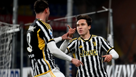 GENOA, ITALY - DECEMBER 15: Federico Chiesa of Juventus celebrates 0-1 goal with Dusan Vlahovic during the Serie A TIM match between Genoa CFC and Juventus at Stadio Luigi Ferraris on December 15, 2023 in Genoa, Italy. (Photo by Daniele Badolato - Juventus FC/Juventus FC via Getty Images)