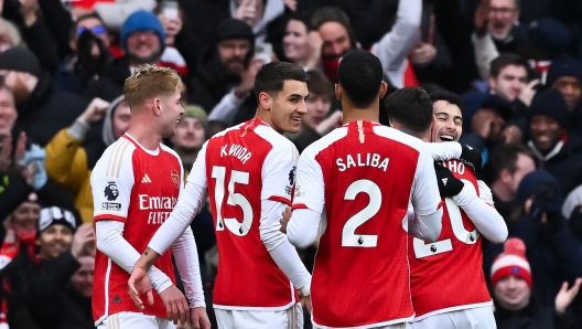 Arsenal's Brazilian midfielder #11 Gabriel Martinelli (R) celebrates after scoring his team fifth goal during the English Premier League football match between Arsenal and Crystal Palace at the Emirates Stadium in London on January 20, 2024. (Photo by Ben Stansall / AFP) / RESTRICTED TO EDITORIAL USE. No use with unauthorized audio, video, data, fixture lists, club/league logos or 'live' services. Online in-match use limited to 120 images. An additional 40 images may be used in extra time. No video emulation. Social media in-match use limited to 120 images. An additional 40 images may be used in extra time. No use in betting publications, games or single club/league/player publications. /