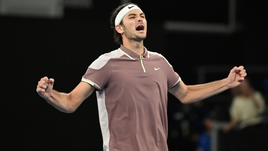 epa11093314 Taylor Fritz of the USA reacts after winning his 4th round match against Stefanos Tsitsipas of Greece  on Day 8 of the 2024 Australian Open at Melbourne Park in Melbourne, Australia, 21 January 2024.  EPA/JAMES ROSS AUSTRALIA AND NEW ZEALAND OUT