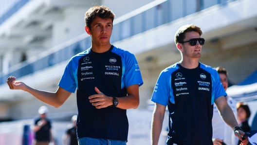 AUSTIN, TEXAS - OCTOBER 20: Alexander Albon of Thailand and Williams and Logan Sargeant of United States and Williams walk in the Paddock prior to practice ahead of the F1 Grand Prix of United States at Circuit of The Americas on October 20, 2023 in Austin, Texas.   Rudy Carezzevoli/Getty Images/AFP (Photo by Rudy Carezzevoli / GETTY IMAGES NORTH AMERICA / Getty Images via AFP)