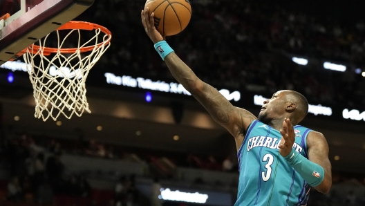 Charlotte Hornets guard Terry Rozier (3) goes to the basket during the second half of an NBA basketball game against the Miami Heat, Sunday, Jan. 14, 2024, in Miami. (AP Photo/Lynne Sladky)