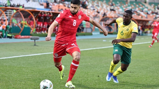 Tunisia's midfielder #8 Hamza Rafia fights for the ball with South Africa's defender #6 Aubrey Modiba during the Africa Cup of Nations (CAN) 2024 group E football match between South Africa and Tunisia at the Amadou Gon Coulibaly Stadium in Korhogo on January 24, 2024. (Photo by FADEL SENNA / AFP)