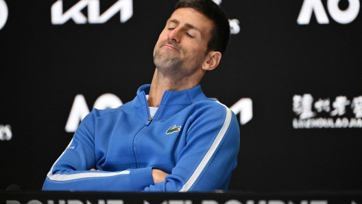 Serbia's Novak Djokovic attends a press conference after losing against Italy's Jannik Sinner in their men's singles semi-final match on day 13 of the Australian Open tennis tournament in Melbourne on January 26, 2024. (Photo by Saeed KHAN / AFP) / -- IMAGE RESTRICTED TO EDITORIAL USE - STRICTLY NO COMMERCIAL USE --