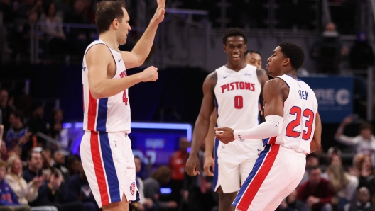 DETROIT, MICHIGAN - DECEMBER 30: Jaden Ivey #23 of the Detroit Pistons celebrates a second half three point basket with Bojan Bogdanovic #44 of the Detroit Pistons while playing the Toronto Raptors at Little Caesars Arena on December 30, 2023 in Detroit, Michigan. Detroit won the game 129-127. NOTE TO USER: User expressly acknowledges and agrees that, by downloading and or using this photograph, User is consenting to the terms and conditions of the Getty Images License Agreement.   Gregory Shamus/Getty Images/AFP (Photo by Gregory Shamus / GETTY IMAGES NORTH AMERICA / Getty Images via AFP)