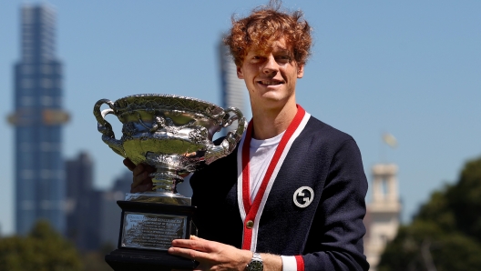 MELBOURNE, AUSTRALIA - JANUARY 29: Jannik Sinner of Italy poses with the Norman Brookes Challenge Cup after winning the 2024 Australian Open Final, at Royal Botanic Gardens on January 29, 2024 in Melbourne, Australia. (Photo by Kelly Defina/Getty Images)