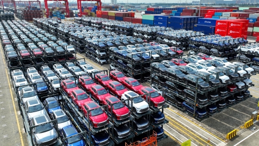 (FILES) This file photo taken on September 11, 2023 shows BYD electric cars waiting to be loaded on a ship are stacked at the international container terminal of Taicang Port at Suzhou Port, in China?s eastern Jiangsu Province. China overtook Japan as the world's biggest vehicle exporter last year, data from the Japan Automobile Manufacturers Association (JAMA) showed on January 31, 2024. (Photo by AFP) / China OUT