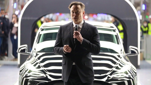 epa09842403 Tesla CEO Elon Musk speaks during the opening day of the Tesla 'Gigafactory' in Gruenheide near Berlin, Germany, 22 March 2022.  EPA/CHRISTIAN MARQUARDT / POOL