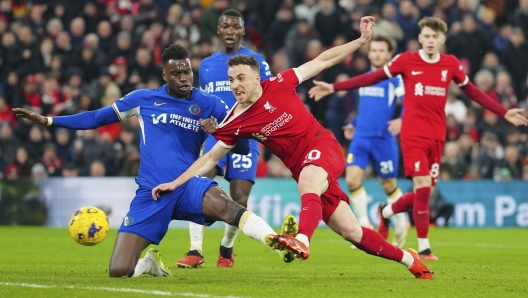 Liverpool's Diogo Jota scores his side's first goal during the English Premier League soccer match between Liverpool and Chelsea, at Anfield Stadium, Liverpool, England, Wednesday, Jan.31, 2024. (AP Photo/Jon Super)