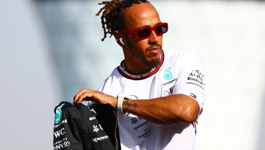 ABU DHABI, UNITED ARAB EMIRATES - NOVEMBER 26: Lewis Hamilton of Great Britain and Mercedes looks on from the drivers parade prior to the F1 Grand Prix of Abu Dhabi at Yas Marina Circuit on November 26, 2023 in Abu Dhabi, United Arab Emirates. (Photo by Mark Thompson/Getty Images)