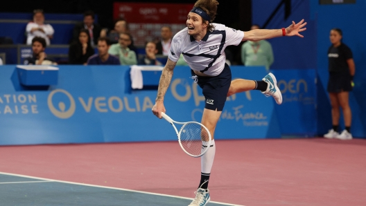 Kazakhstan's Alexander Bublik (L) serves the ball to Croatia's Borna Coric during their ATP World Tour Open Sud de France final tennis match, in Montpellier, southern France, on February 4, 2024. (Photo by Pascal GUYOT / AFP)