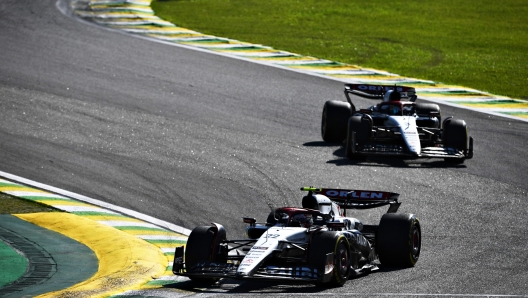 SAO PAULO, BRAZIL - NOVEMBER 05: Yuki Tsunoda of Japan driving the (22) Scuderia AlphaTauri AT04 leads Daniel Ricciardo of Australia driving the (3) Scuderia AlphaTauri AT04 on track during the F1 Grand Prix of Brazil at Autodromo Jose Carlos Pace on November 05, 2023 in Sao Paulo, Brazil. (Photo by Rudy Carezzevoli/Getty Images)